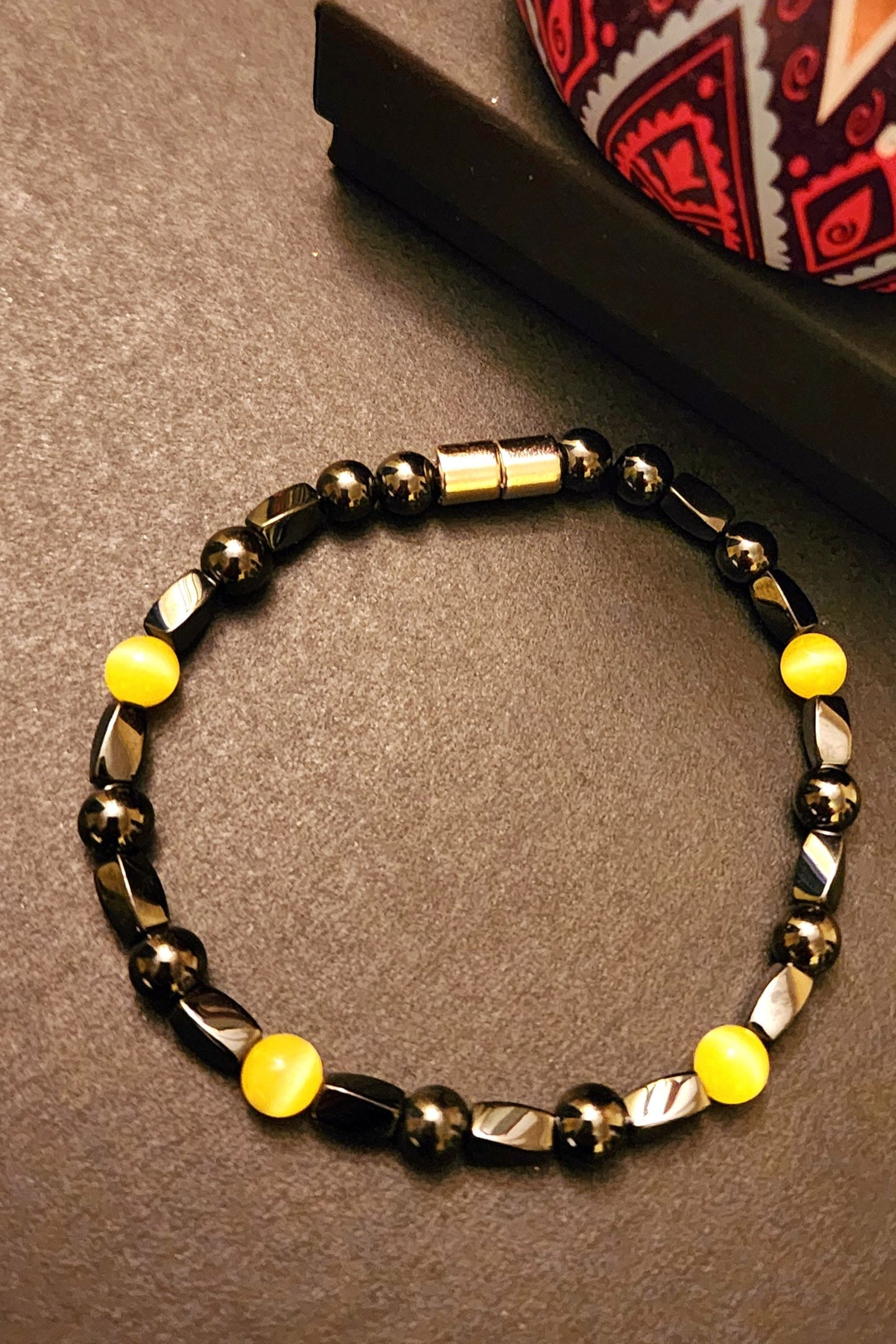 HEMATITE MAGNETIC BRACELET WITH YELLOW GEMSTONE BEADS