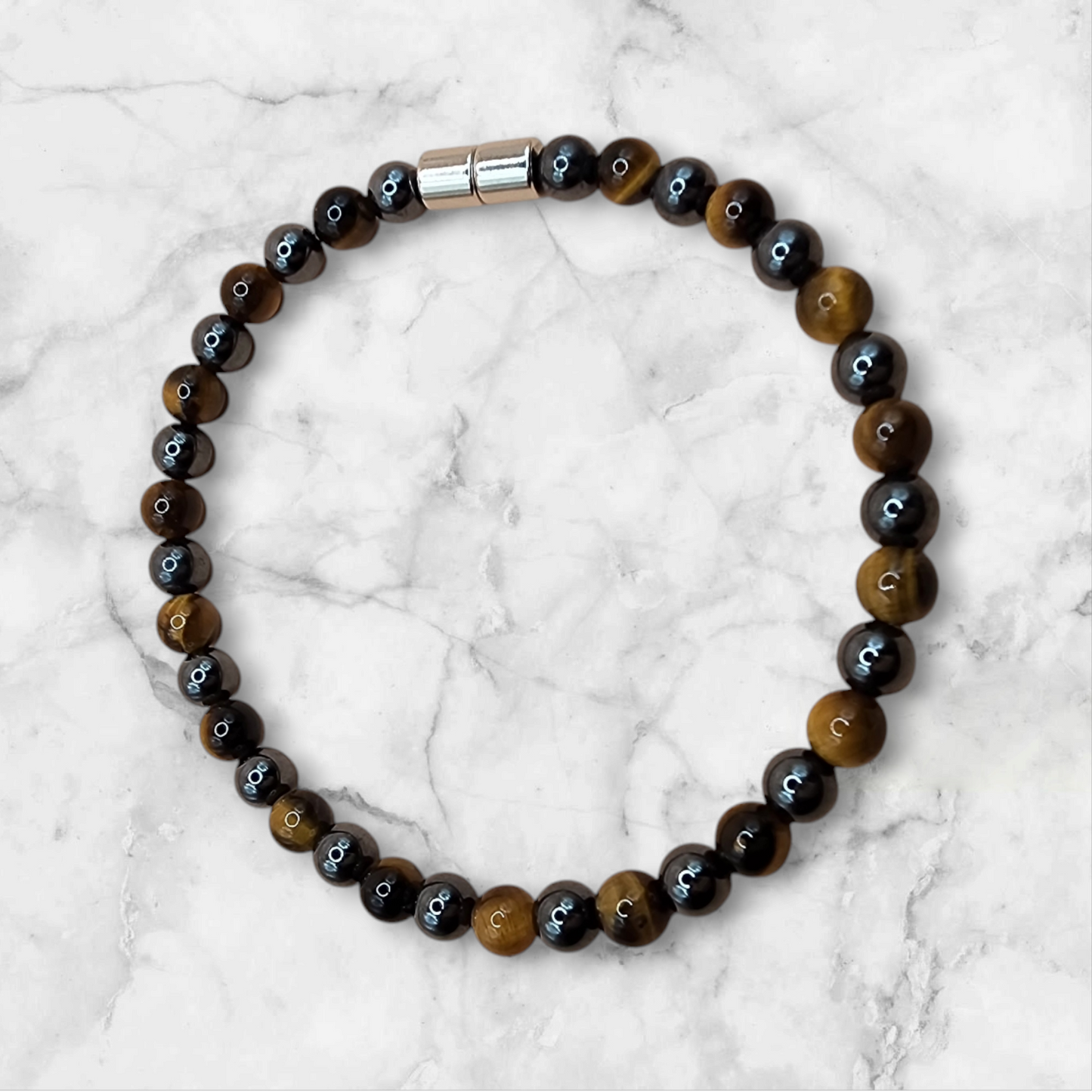 SINGLE STRAND BRACELET WITH MAGNETIC HEMATITE AND CAT EYE GEMSTONE